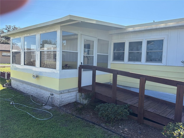 975 Crk 461, Lake Panasoffkee, FL 33538 - view of side of property with a wooden deck and a sunroom