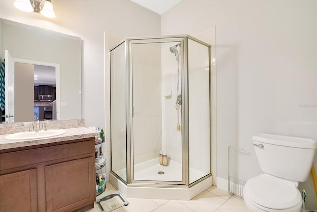 bathroom featuring vanity, toilet, tile patterned floors, and a shower with door