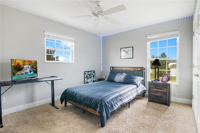 carpeted bedroom featuring ceiling fan