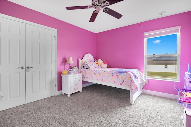 carpeted bedroom with a closet and ceiling fan