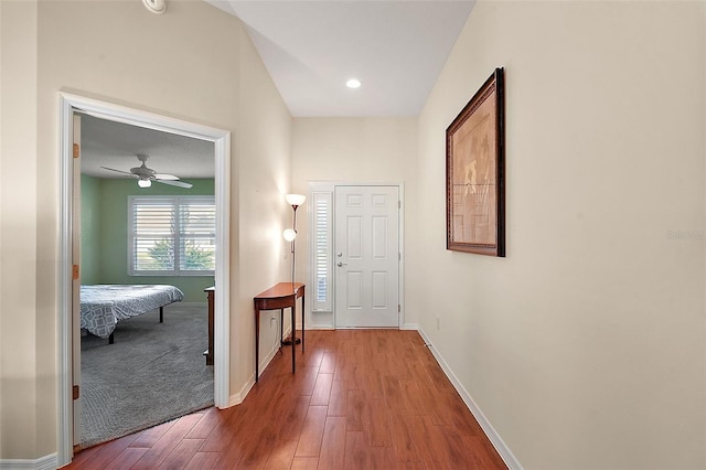 corridor with hardwood / wood-style floors