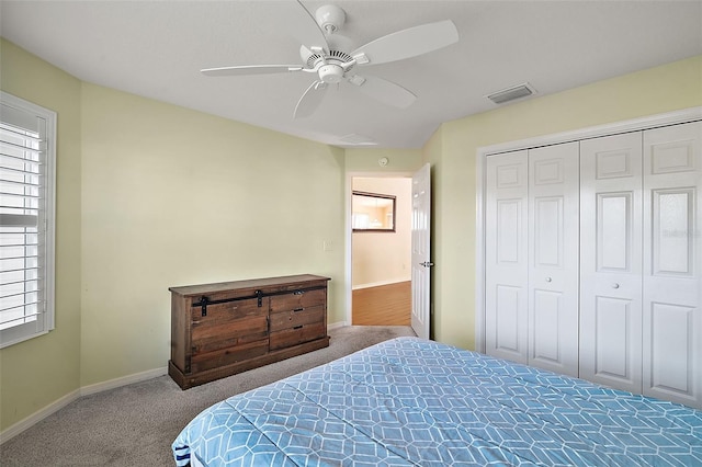 bedroom with carpet, a closet, and ceiling fan