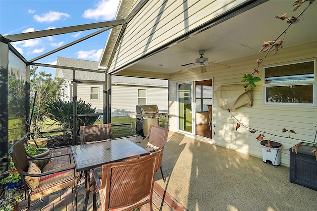 exterior space with grilling area, ceiling fan, and a lanai