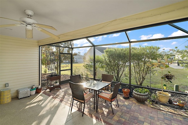 sunroom featuring a wealth of natural light and ceiling fan