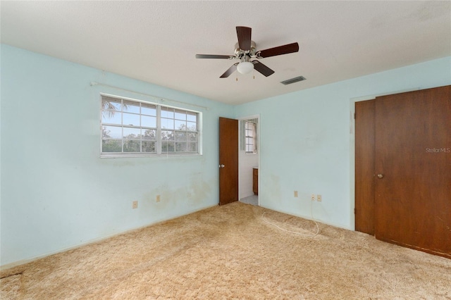 unfurnished bedroom with carpet flooring and ceiling fan