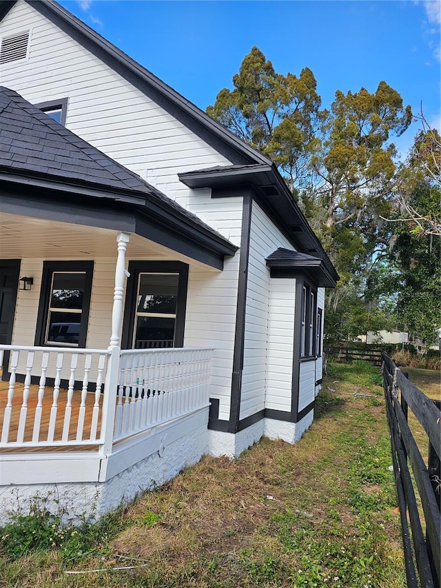 view of home's exterior featuring covered porch