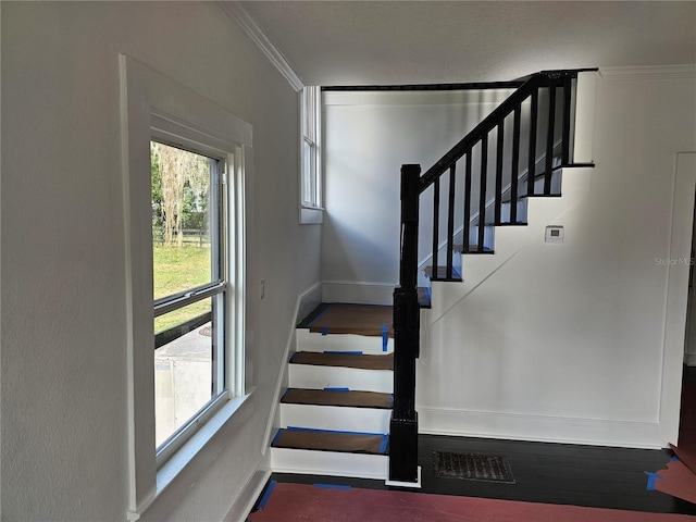 stairway with crown molding