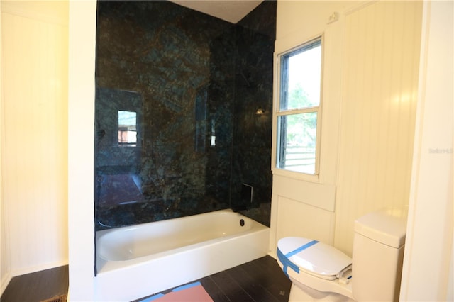 bathroom with hardwood / wood-style flooring and toilet