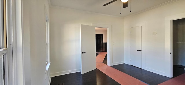 unfurnished bedroom with dark hardwood / wood-style floors, ceiling fan, and ornamental molding