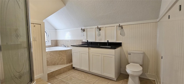 full bathroom featuring vanity, plus walk in shower, vaulted ceiling, tile patterned flooring, and toilet