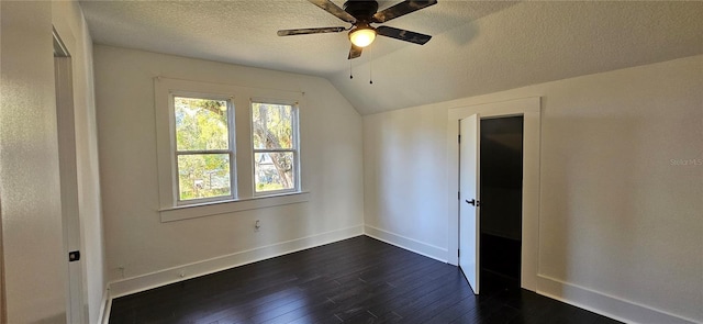 additional living space featuring a textured ceiling, dark hardwood / wood-style floors, ceiling fan, and lofted ceiling