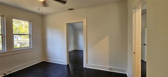 unfurnished room with dark hardwood / wood-style floors, ceiling fan, and crown molding