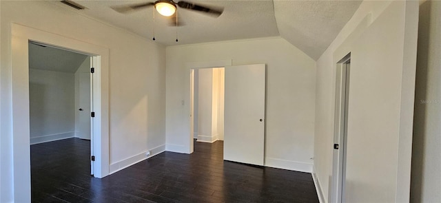 unfurnished bedroom with vaulted ceiling, ceiling fan, ornamental molding, a textured ceiling, and dark hardwood / wood-style flooring