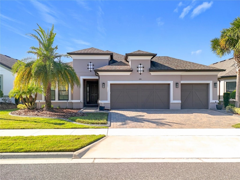 view of front of property with a garage