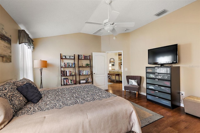 bedroom with ceiling fan, a textured ceiling, vaulted ceiling, and dark wood-type flooring