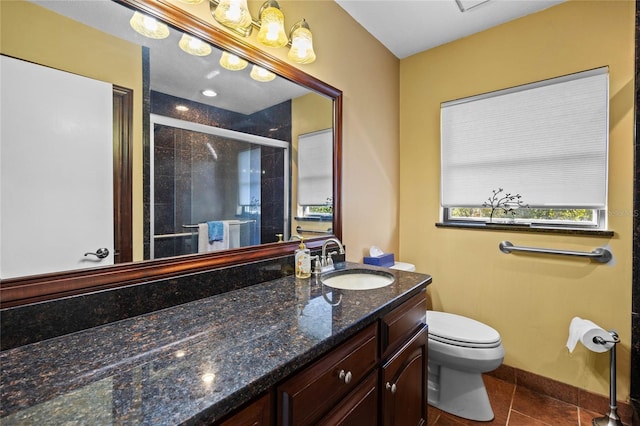 bathroom featuring walk in shower, tile patterned flooring, vanity, and toilet