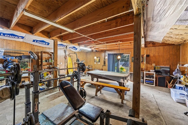 workout area with a workshop area and wooden walls