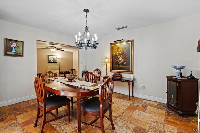 dining room with ceiling fan with notable chandelier