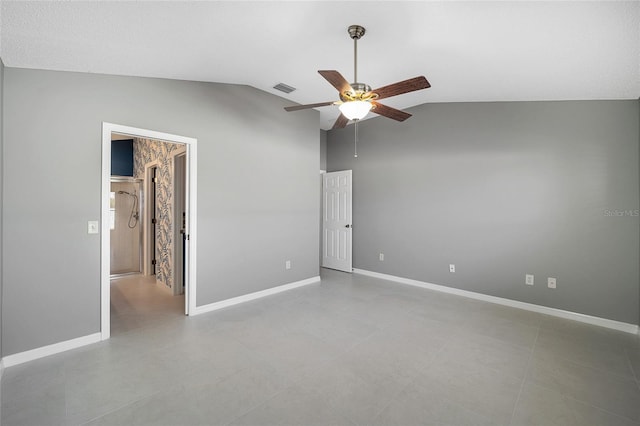 unfurnished bedroom featuring vaulted ceiling, ceiling fan, and ensuite bathroom