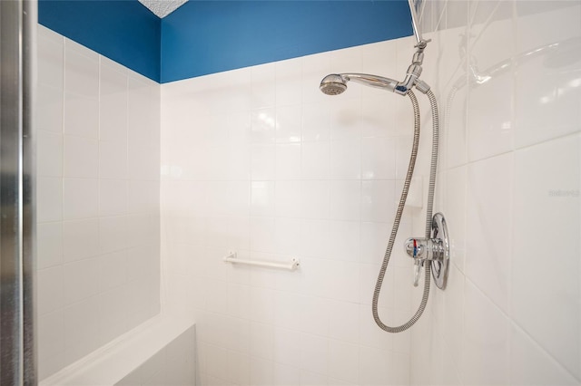 bathroom with tiled shower