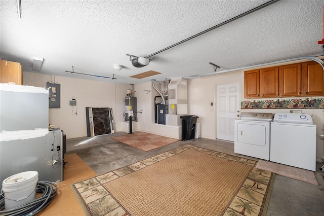 garage with washer and dryer, electric panel, water heater, and a garage door opener