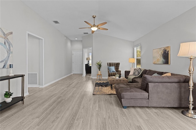 living room with ceiling fan, lofted ceiling, and light wood-type flooring