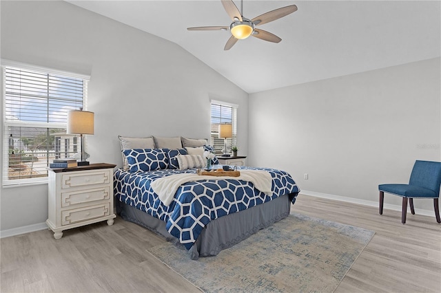 bedroom featuring light hardwood / wood-style flooring, ceiling fan, and vaulted ceiling