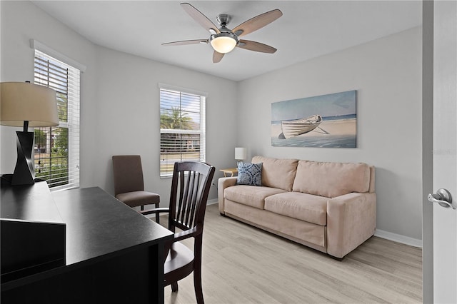 office featuring ceiling fan and light hardwood / wood-style flooring