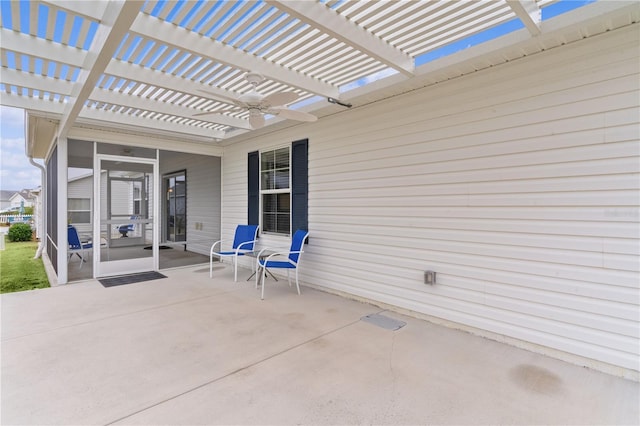 view of patio / terrace featuring a pergola and a sunroom