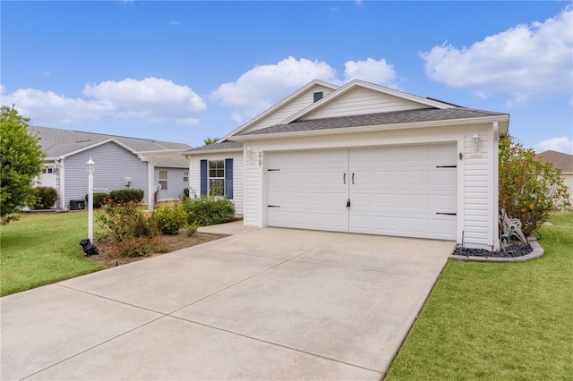 ranch-style house featuring a garage and a front lawn