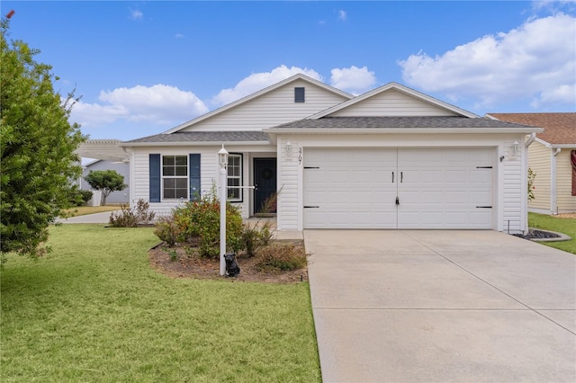 ranch-style home featuring a garage and a front lawn