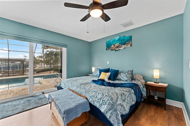 bedroom with hardwood / wood-style floors, ceiling fan, and access to outside