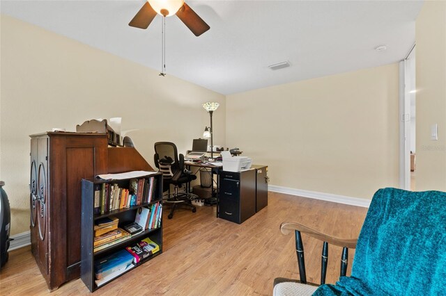 office with ceiling fan and light hardwood / wood-style floors