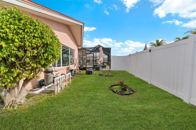 view of yard featuring glass enclosure