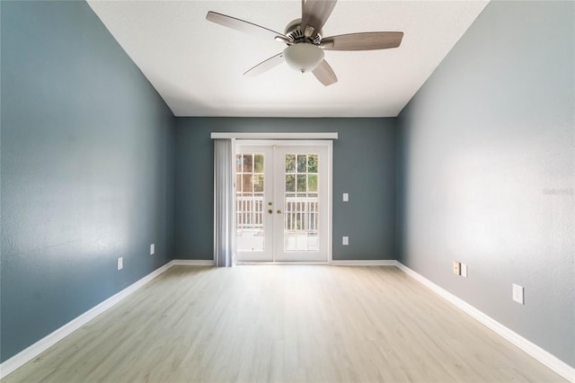 spare room featuring ceiling fan, light hardwood / wood-style floors, and french doors