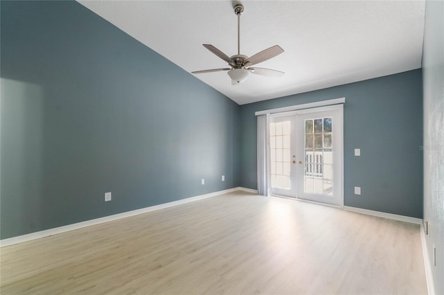 unfurnished room featuring french doors, light hardwood / wood-style floors, vaulted ceiling, and ceiling fan