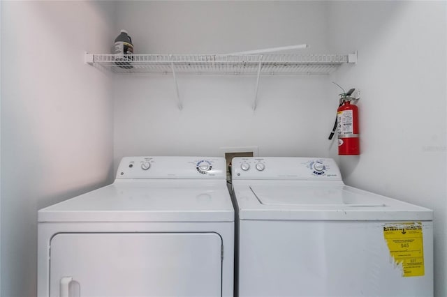 washroom featuring independent washer and dryer