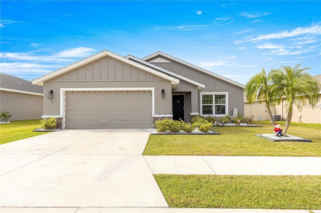 view of front of property featuring a garage and a front yard