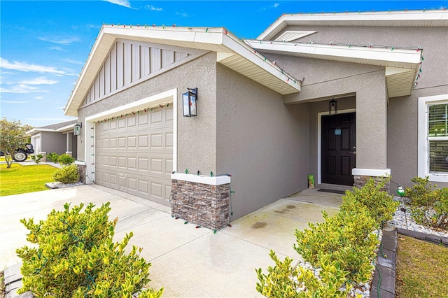 view of exterior entry featuring a garage