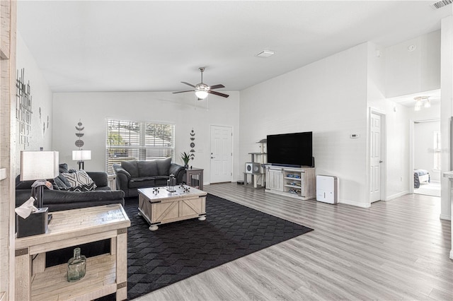 living room featuring hardwood / wood-style flooring and ceiling fan