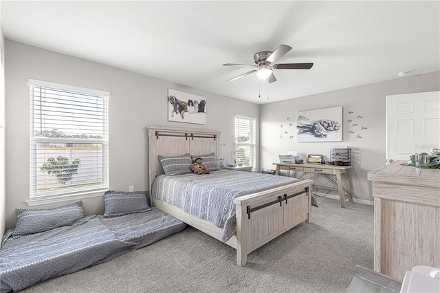 bedroom featuring light carpet and ceiling fan