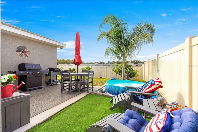 view of patio with a grill