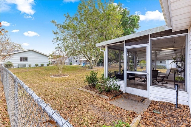 view of yard with a sunroom