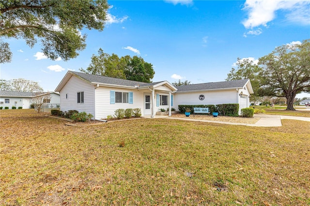 ranch-style house with a front lawn