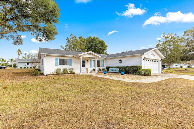 ranch-style house with a garage and a front yard