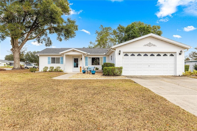 single story home featuring a garage and a front lawn