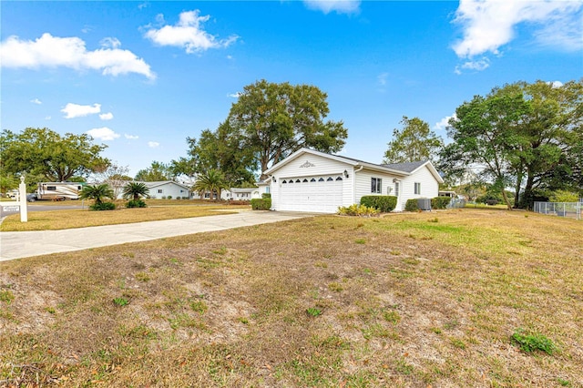 single story home featuring a front yard and a garage