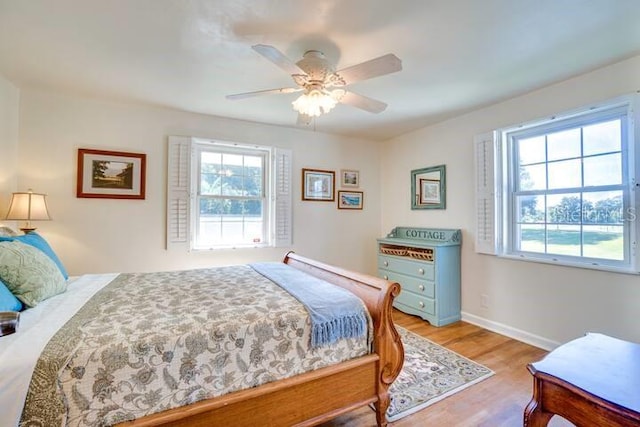 bedroom featuring ceiling fan and light hardwood / wood-style flooring