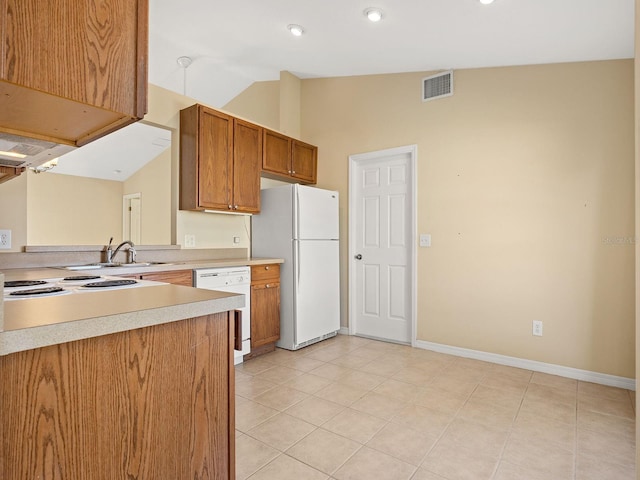 kitchen with sink, kitchen peninsula, vaulted ceiling, white appliances, and light tile patterned floors