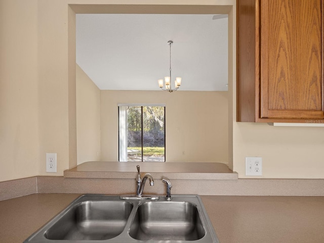 kitchen featuring hanging light fixtures, a notable chandelier, and sink